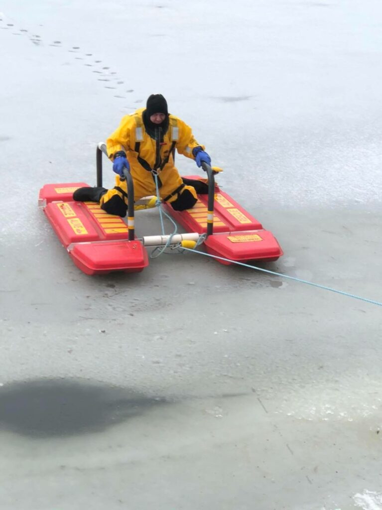 A man ussing a board in the snow