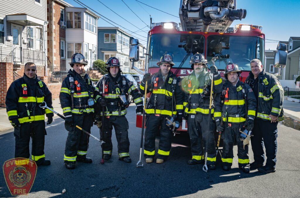 Everett Firefighters standing in front of a firetruck
